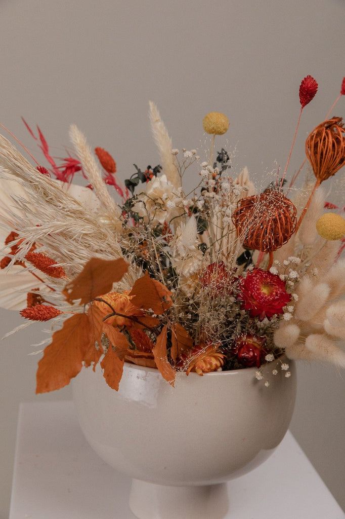 hiddenbotanicsweddings Autumn Leaves Burnt Orange Dried Flowers with Palm Leaf Loose Flowers Centerpiece and Vase Arrangement